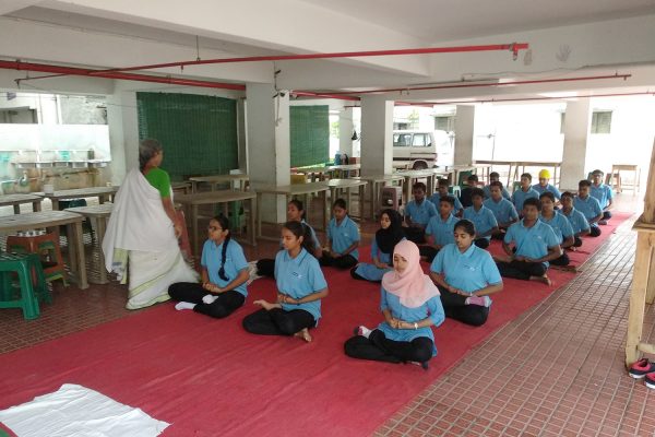 Kompass Students Practicing Yoga